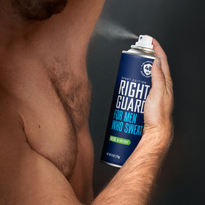 Man applying Right Guard sport aerosol antiperspirant and deodorant